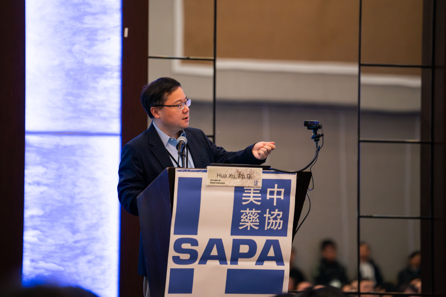 Keynote speaker on stage at the SAPA-GP 2024 Annual Conference